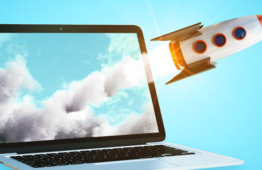 Rocket shooting out of computer monitor promoting hotel website